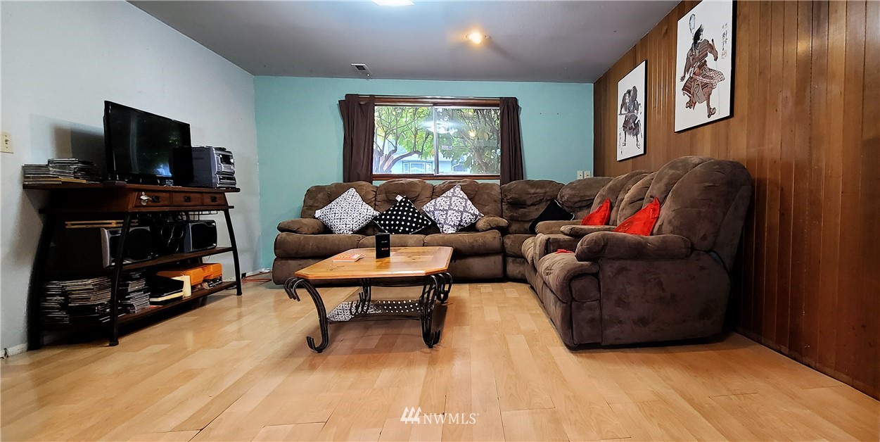 2304 Southeast 21st Street Renton, WA 98055 - Photo 17 of 19 a living room with furniture and a flat screen tv