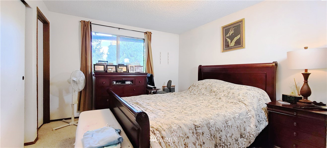 2304 Southeast 21st Street Renton, WA 98055 - Photo 18 of 19 a bedroom with a bed and a window