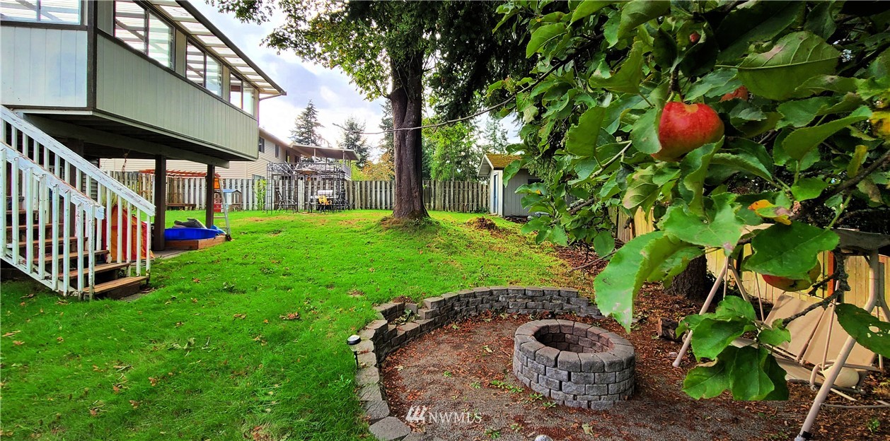 2304 Southeast 21st Street Renton, WA 98055 - Photo 4 of 19 a backyard of a house with lots of green space