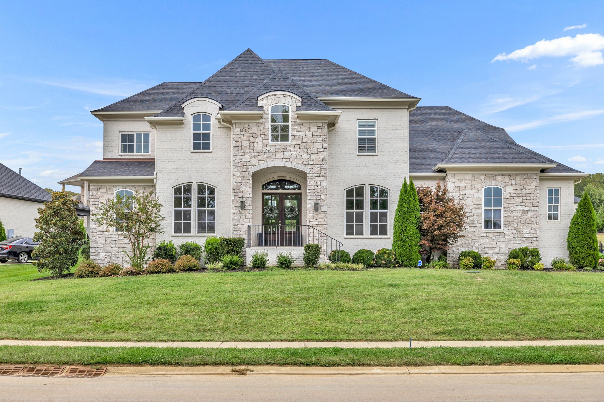 a front view of a house with a yard