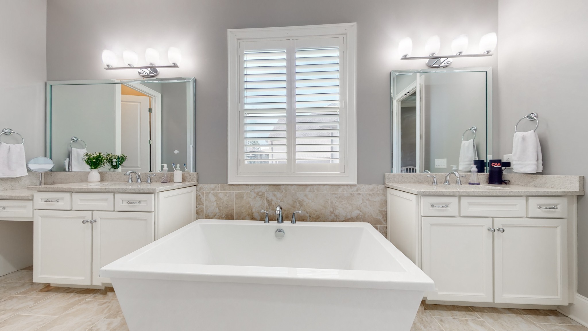 6023 Lookaway Circle Franklin, TN 37067 - Photo 28 of 50 a bathroom with a bathtub a sink and a window