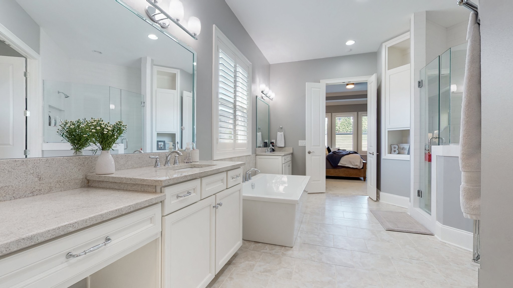 6023 Lookaway Circle Franklin, TN 37067 - Photo 29 of 50 a spacious en suite bathroom with a granite countertop sink a mirror and a shower
