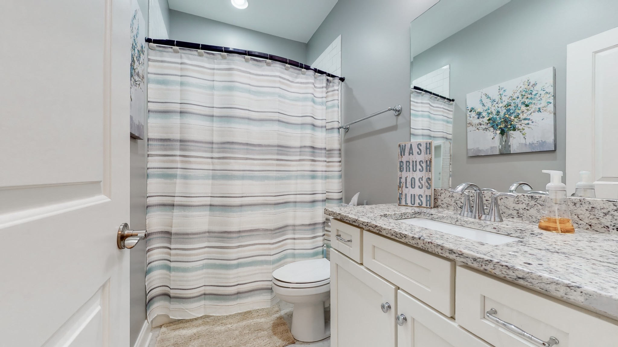 6023 Lookaway Circle Franklin, TN 37067 - Photo 33 of 50 a bathroom with a granite countertop sink mirror vanity and toilet