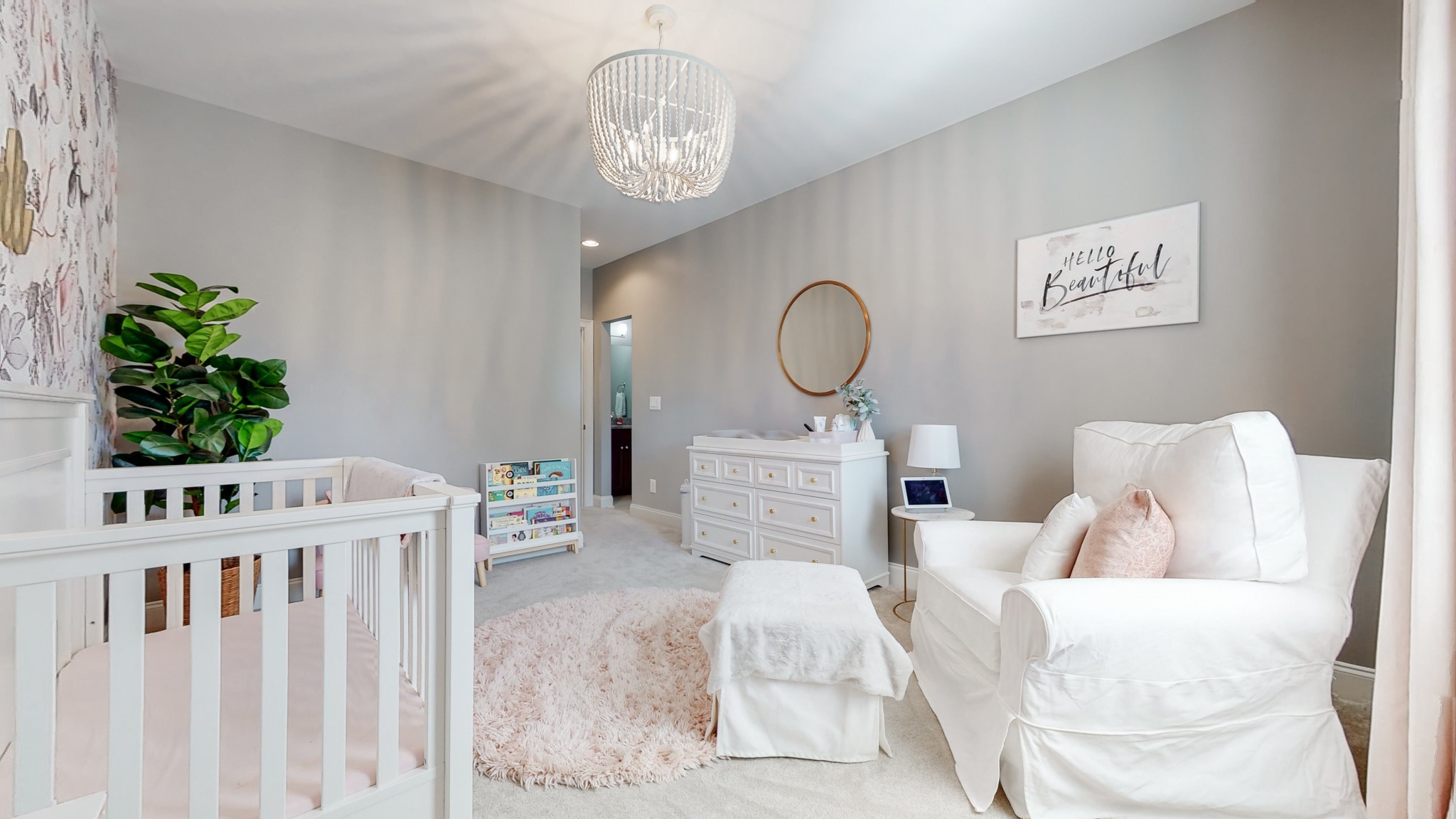 6023 Lookaway Circle Franklin, TN 37067 - Photo 44 of 50 a bedroom with a bed a chandelier and a mirror