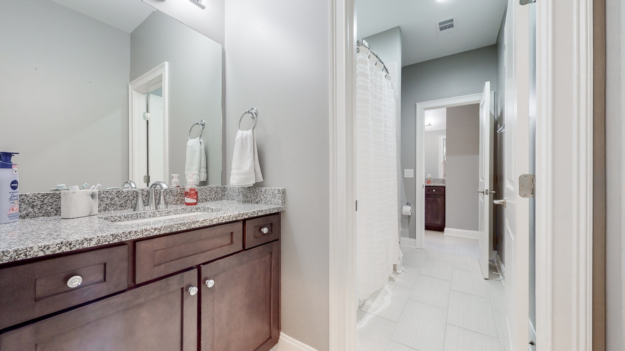 6023 Lookaway Circle Franklin, TN 37067 - Photo 45 of 50 a bathroom with a granite countertop sink and a mirror