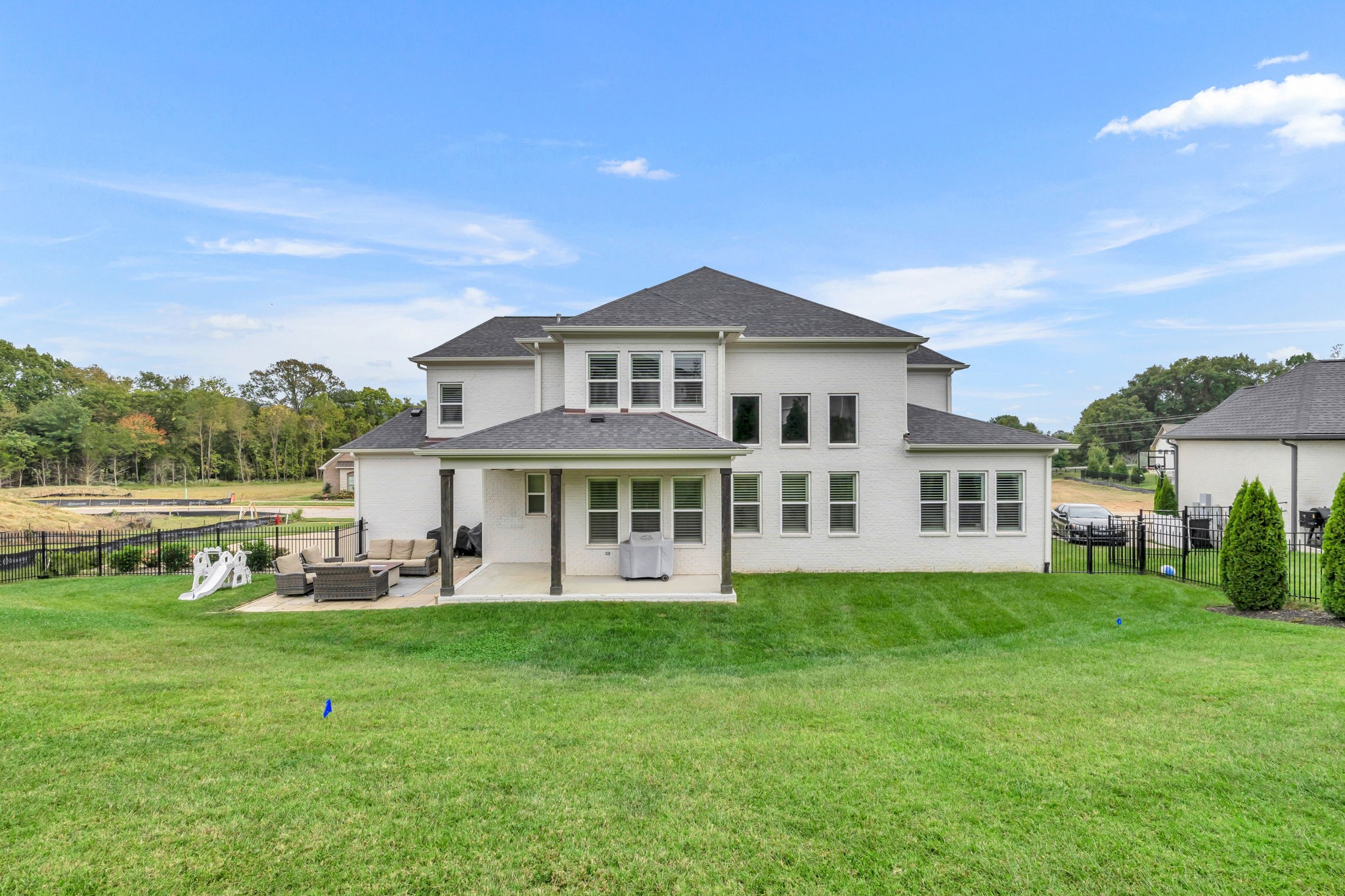 6023 Lookaway Circle Franklin, TN 37067 - Photo 49 of 50 a front view of a house with a garden and trees