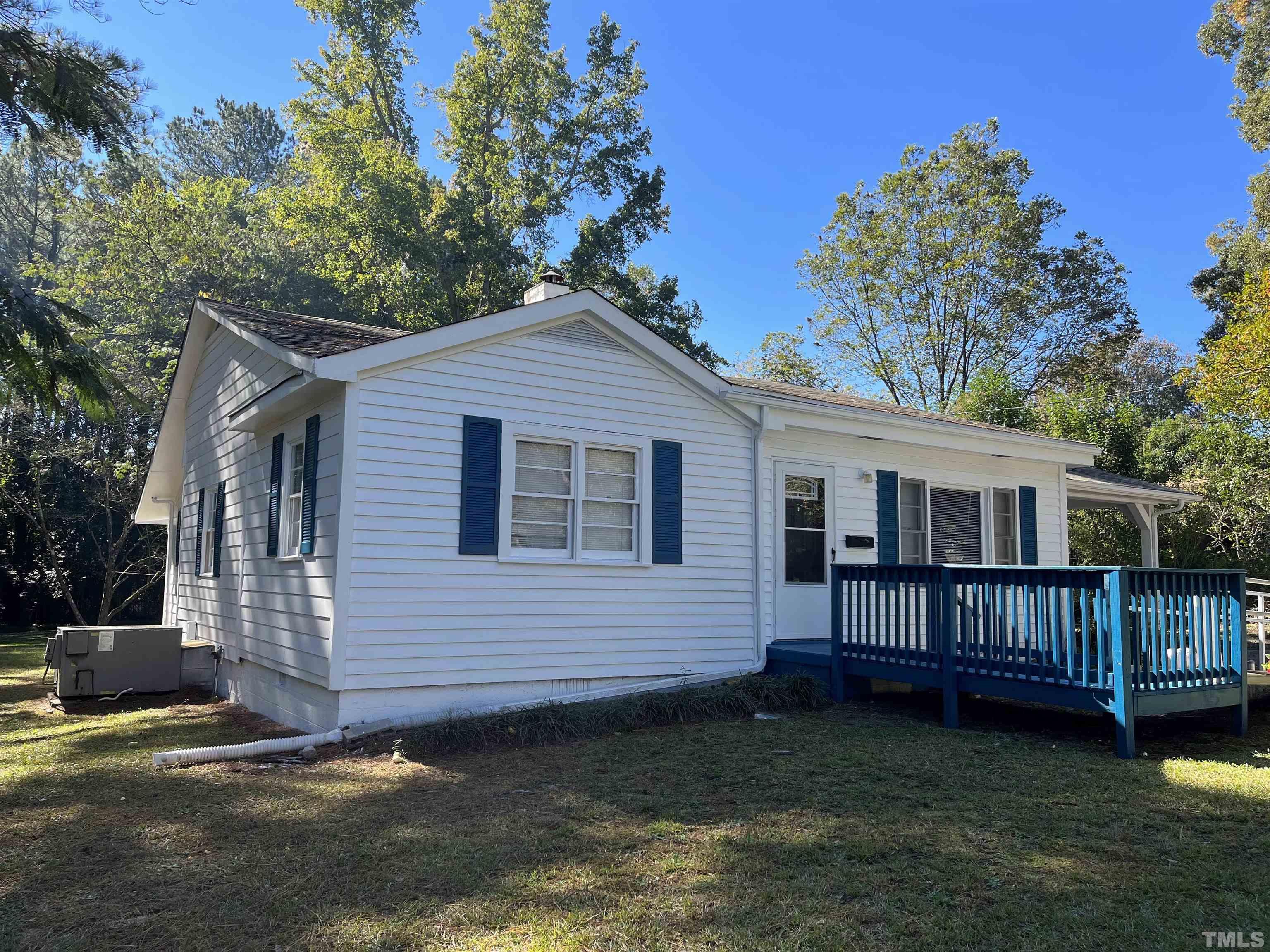 923 Ranch Farm Road Raleigh, NC 27603 - Photo 1 of 18 a view of a house with a yard and deck