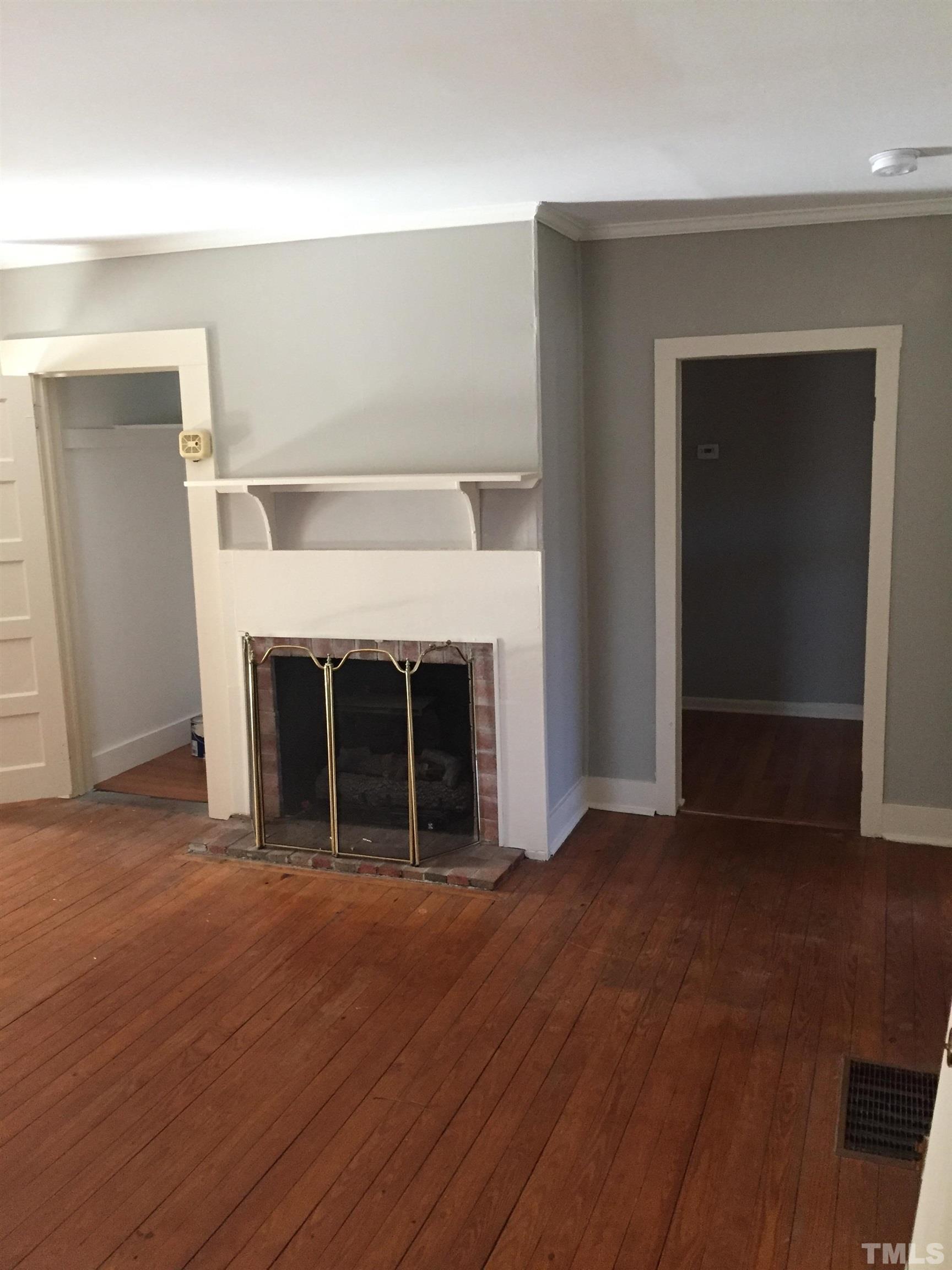 923 Ranch Farm Road Raleigh, NC 27603 - Photo 11 of 18 a view of a livingroom with a fireplace