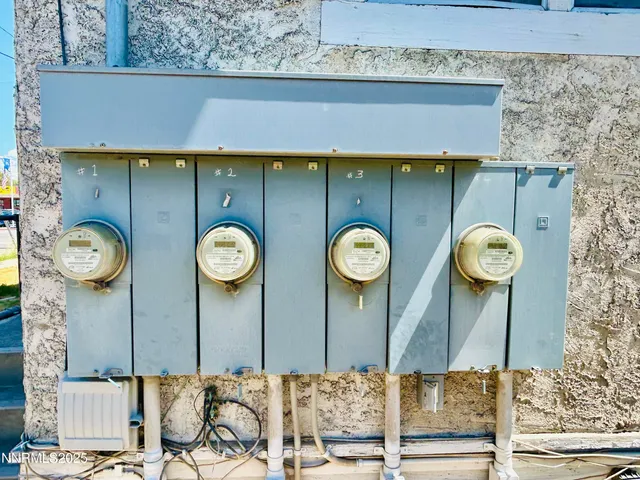 a bathroom with a clock and a shower