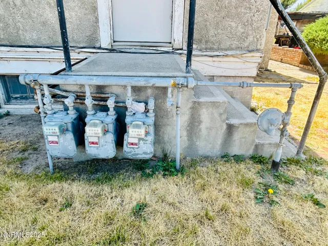 a view of a patio with table and chairs