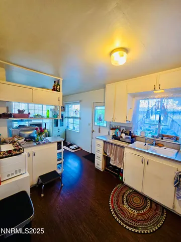 a room with furniture pool table and window