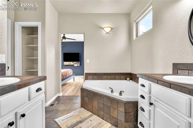 a bathroom with a bathtub and a sink
