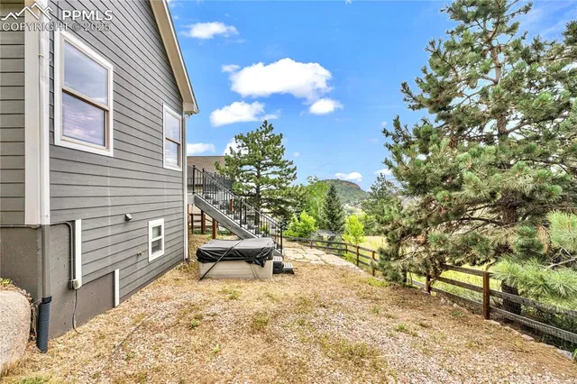 a view of a backyard with sitting area