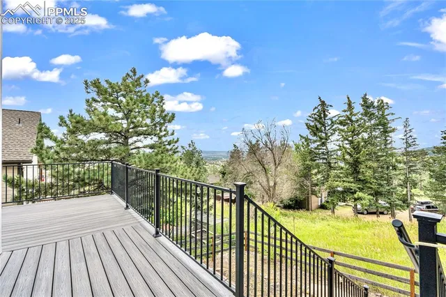 a view of a balcony with wooden floor