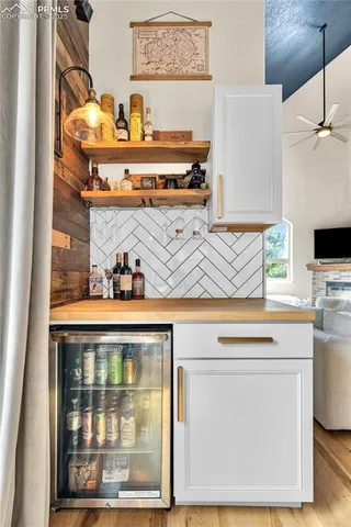 a kitchen with a refrigerator and a stove