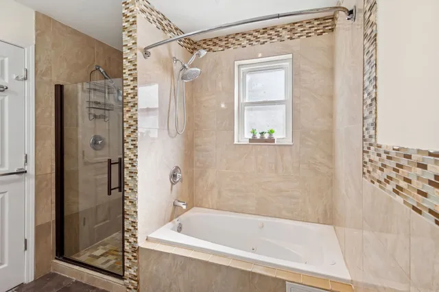 a bathroom with a sink mirror toilet and bathtub