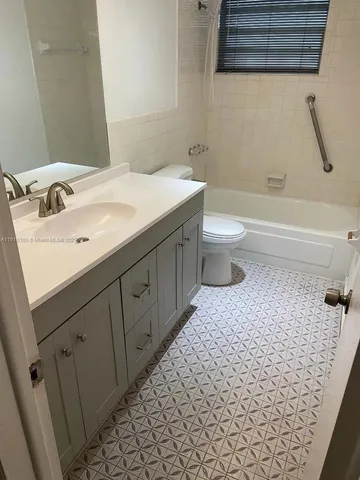 an empty room with wooden floor