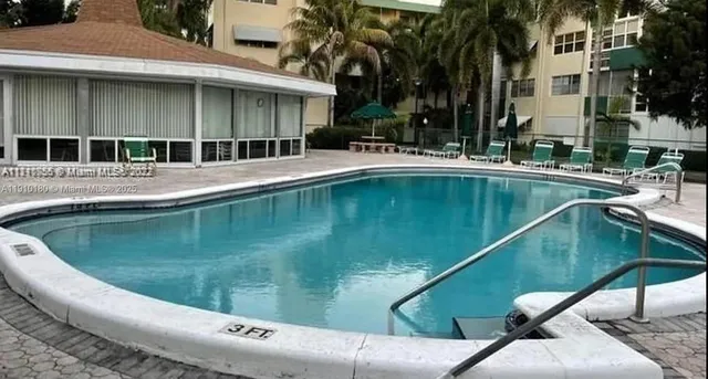 a view of swimming pool with a patio
