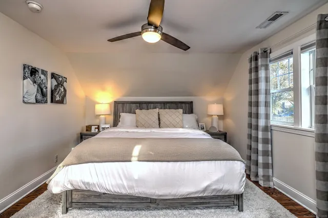 a bedroom with a bed and window