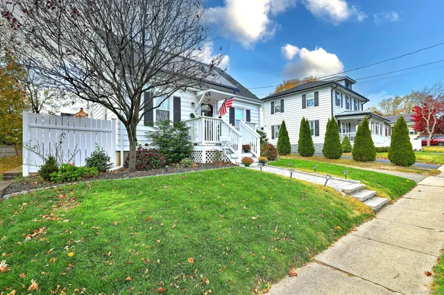 a front view of house with yard and green space