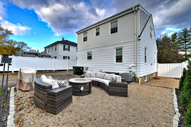 a outdoor living space with furniture and a flat screen tv