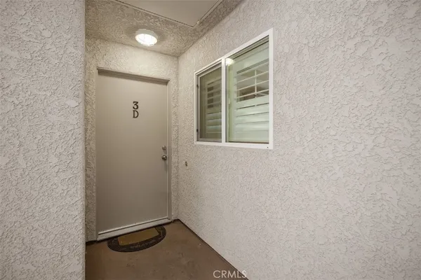 a view of an empty room with windows
