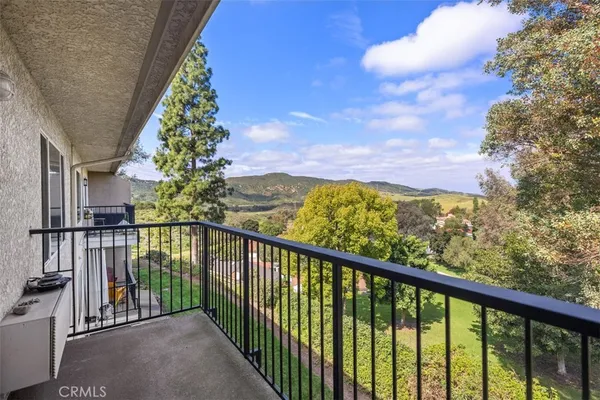 a view of a balcony with an outdoor space