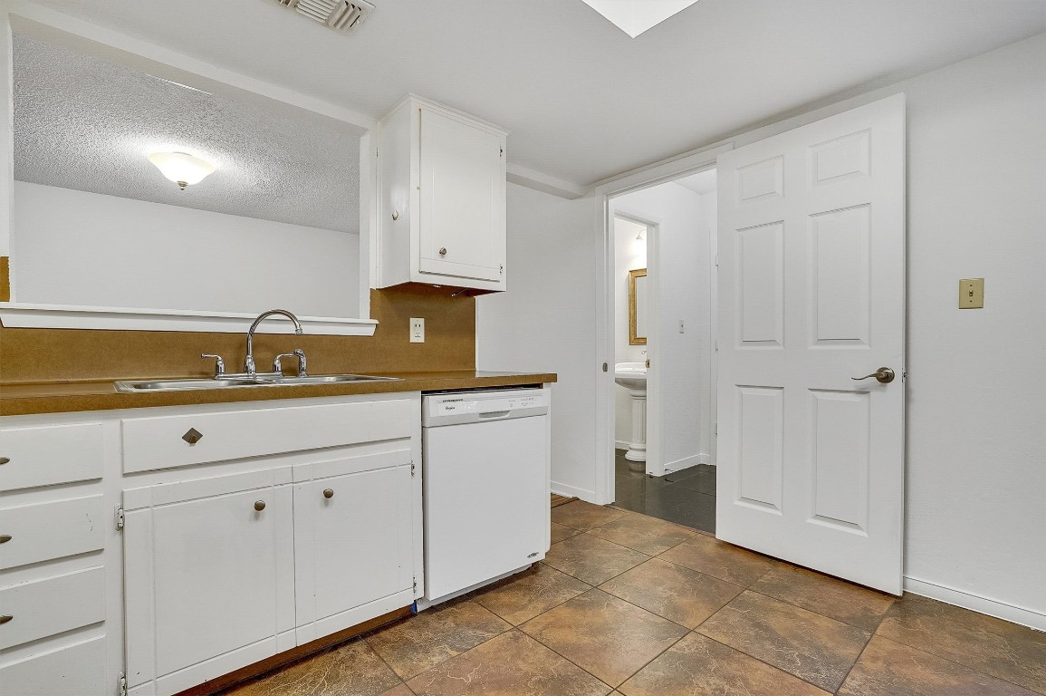 3201 Twinberry Cove, Unit B Austin, TX 78746 - Photo 9 of 19 a bathroom with a sink and a mirror