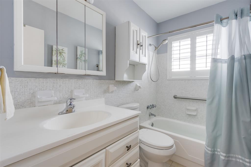 350 South Cypress Road, Unit 522 Pompano Beach, FL 33060 - Photo 11 of 27 a bathroom with a sink a toilet and a bathtub