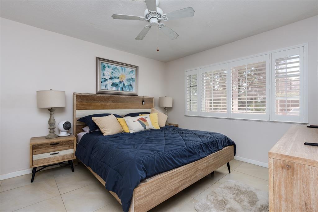 350 South Cypress Road, Unit 522 Pompano Beach, FL 33060 - Photo 15 of 27 a bedroom with a bed and a window