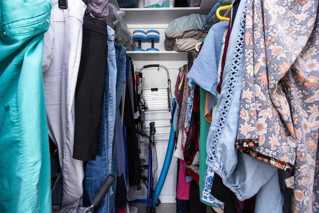 350 South Cypress Road, Unit 522 Pompano Beach, FL 33060 - Photo 16 of 27 a view of walk in closet with clothes and shoes