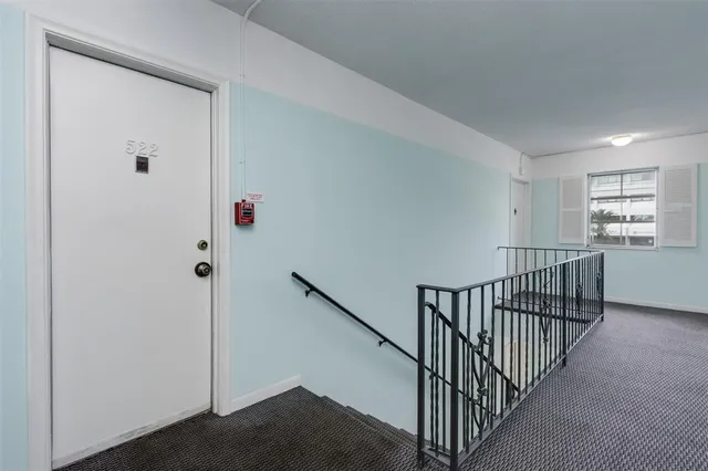 a view of a hallway with windows