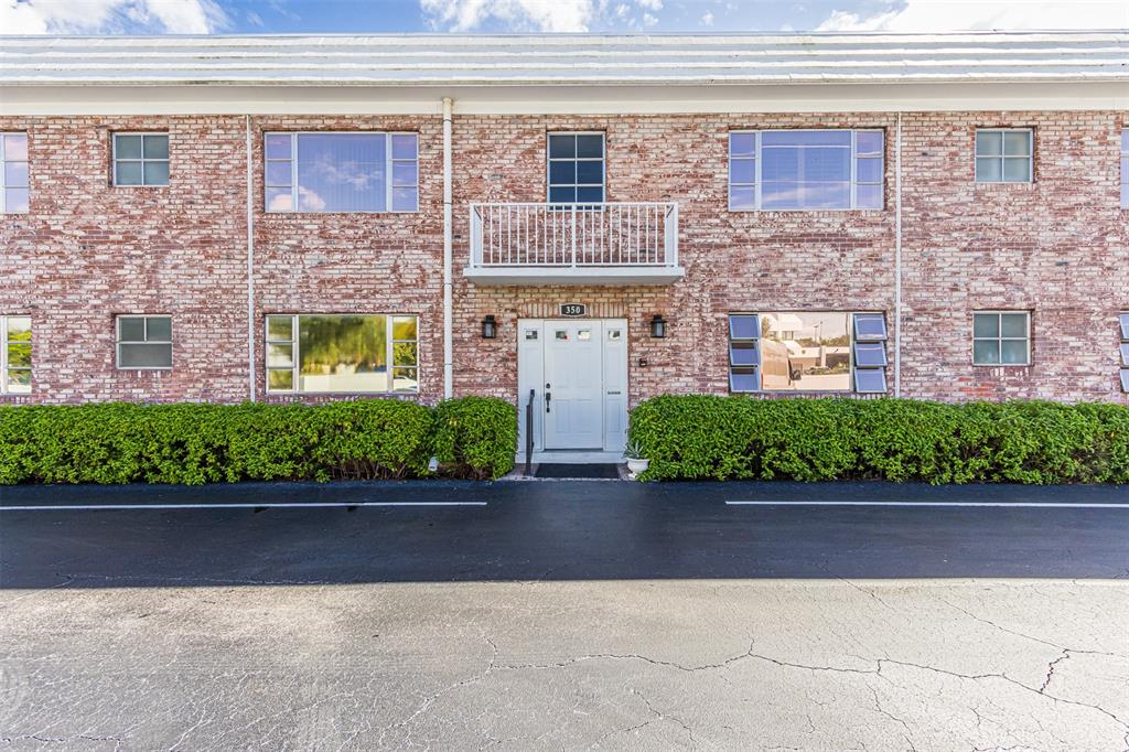 350 South Cypress Road, Unit 522 Pompano Beach, FL 33060 - Photo 2 of 27 a view of front door of house with car parked
