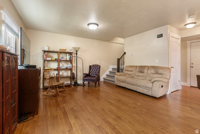 802 Brookside Court Payson, UT 84651 - Photo 11 of 32 Living room with stairs and light wood-style floors