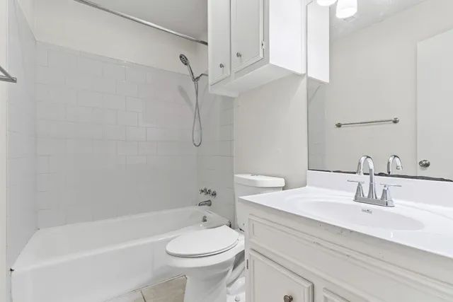 a bathroom with a sink a toilet and a bathtub