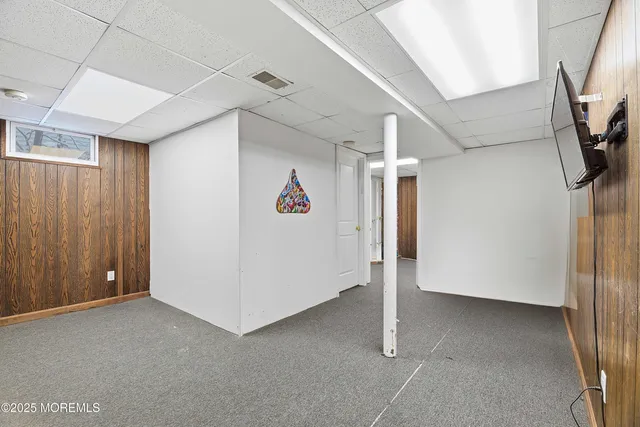 a view of a livingroom with a white walls