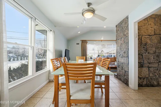 a view of a dining room with furniture window and outside view