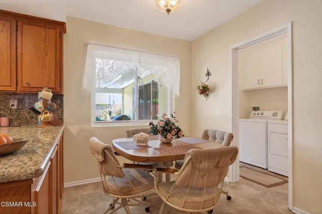 a dining room with furniture and window