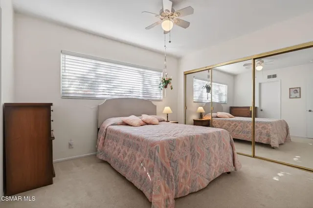 a bedroom with bed and window