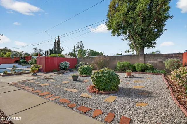 a front view of a house with sitting area