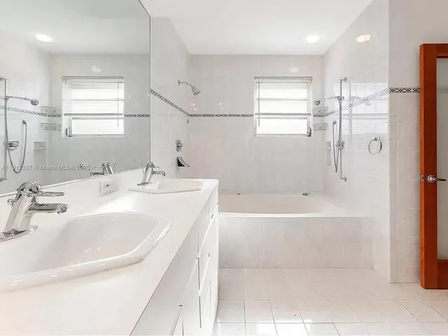 a bathroom with a bathtub and a sink