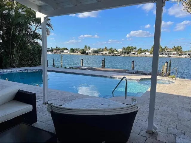 a view of a swimming pool with a terrace