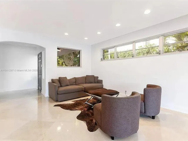 a living room with furniture and window