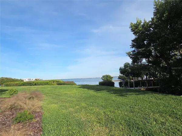 a view of a garden with a building in the background
