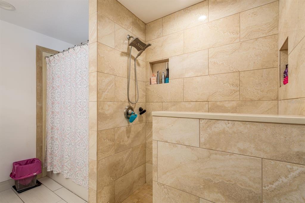 1333 McMullen Booth Road, Unit 1333 Clearwater, FL 33759 - Photo 14 of 26 a bathroom with a shower