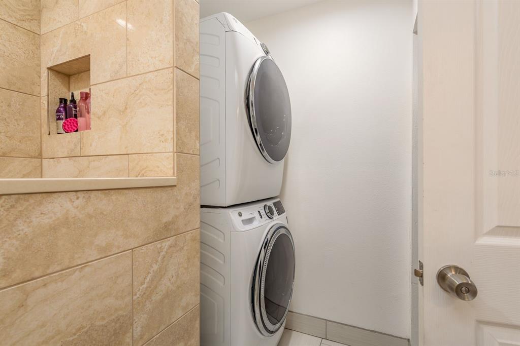 1333 McMullen Booth Road, Unit 1333 Clearwater, FL 33759 - Photo 15 of 26 a utility room with dryer and washer