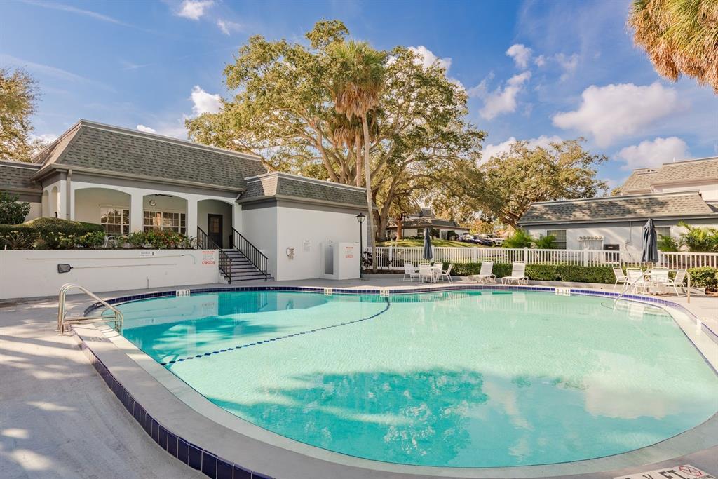 1333 McMullen Booth Road, Unit 1333 Clearwater, FL 33759 - Photo 22 of 26 a view of a house with pool