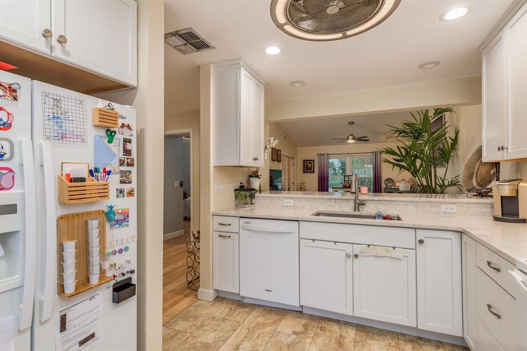 1333 McMullen Booth Road, Unit 1333 Clearwater, FL 33759 - Photo 5 of 26 a bathroom with a sink and a mirror