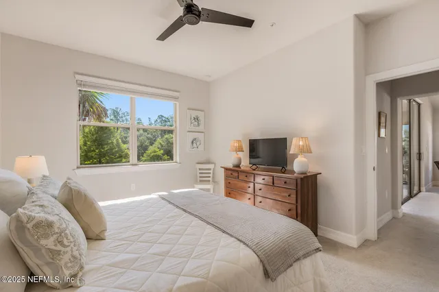 a bedroom with a bed and a television