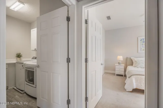 a en suite bathroom with a sink a toilet and a mirror
